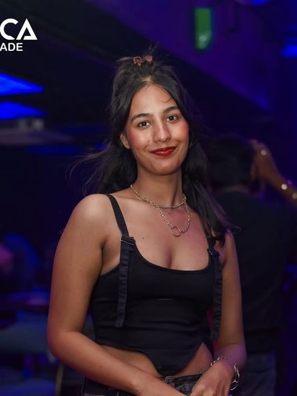 A stylish guest posing for the camera at Toca Brigade.