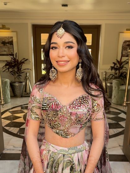 The bride looking radiant and beautiful, her unique hairstyle adding a touch of magic to her look.