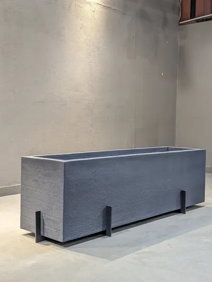 This rectangular FRP planter box with modern legs is perfect for creating a green partition or lining a narrow balcony. It's lightweight and weather-proof.