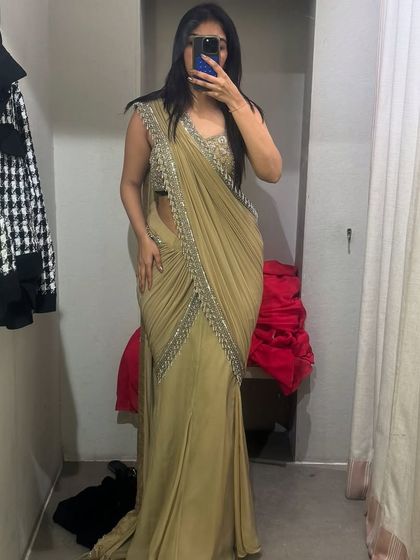 A trial room selfie of a stunning beige pre-draped saree. I often help clients with shopping trips, both online and offline, to find the perfect outfits.
