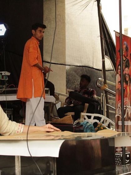 On stage at TEDx SVC, with Saurabh on his guitar, ready to begin our performance. The energy from the student audience was incredible.