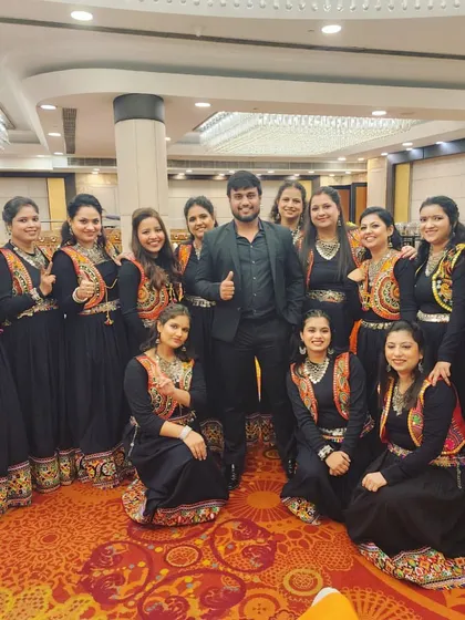 A group photo with the talented ladies' group after their performance at an HMEL company event. I choreograph routines for all employee groups, ensuring everyone can participate and shine.