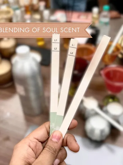 The heart of my craft is the blending of the soul scent. Here, I am testing different fragrance notes to create the exclusive Whispering Jasmine scent for my limited edition wax tablets. It's a process of patience and passion.