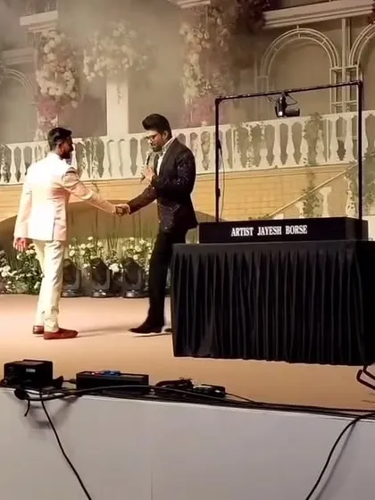 Shaking hands with Manish Paul after a successful show. The smoky, dramatic stage lighting added to the magic of the evening.