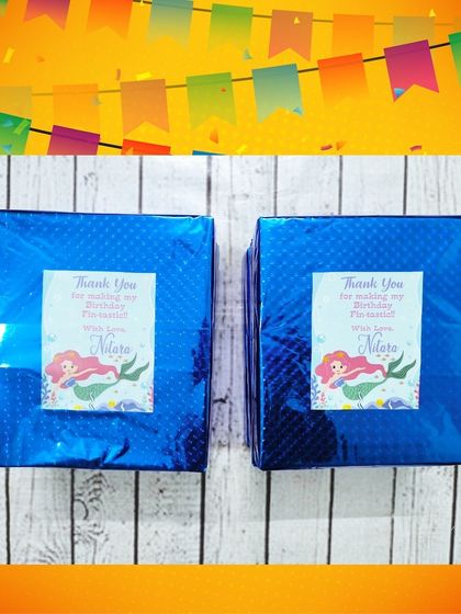 More of the wrapped mobile screen amplifiers, this time in blue shiny paper with a personalized mermaid sticker.