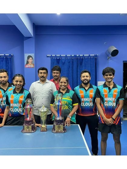 A group photo celebrating multiple wins, including the veterans' title and the Mission Olympics title.