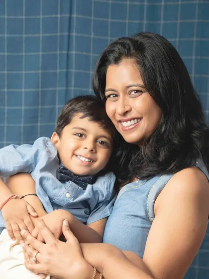 A sweet and gentle moment between mother and son. This close-up portrait beautifully captures their loving expressions and the strong bond they share.
