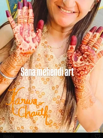 A happy client celebrating Karwa Chauth with a lovely dark mehendi stain.