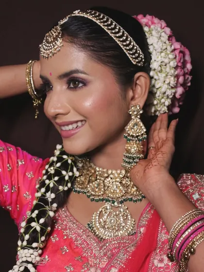 This view showcases the traditional hairstyle with a parandi and floral arrangement.
