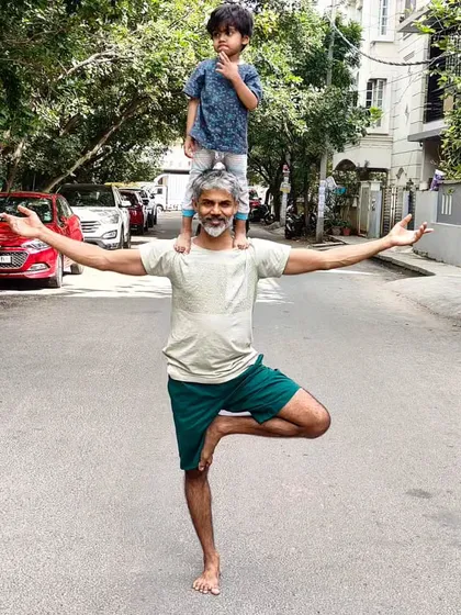 Yoga is for everyone in the family. Sharing my practice with my son is one of my greatest joys. Here, we find balance together in Vrikshasana, or Tree Pose, turning a classic asana into a moment of connection and playfulness.