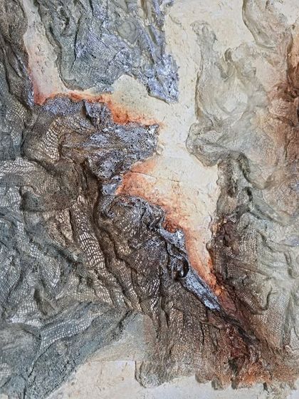 A close-up of mixed media with textures on canvas. The silver and rust-colored tones create a beautiful contrast, highlighting the imperfect beauty of the materials.