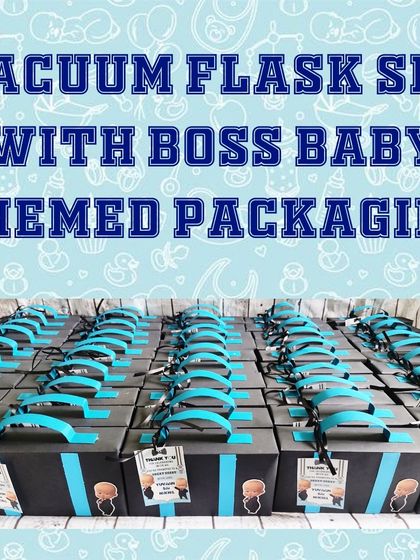 A large order of the Boss Baby themed gift boxes, all lined up and ready for the party. The handle makes them easy for guests to carry.