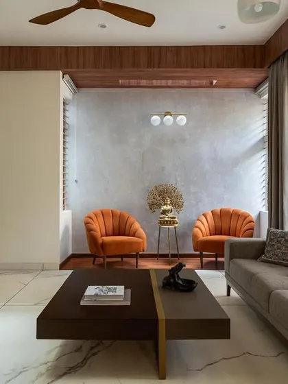 This living room from the 'Chirantana' residence shows how minimalist design can be warm and inviting. I focused on clean lines, a mix of wood and concrete textures, and a layout that complements the home's modern architecture.