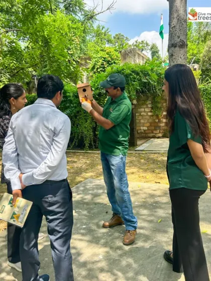 Our team discusses the placement of a nest box with partners from the Aga Khan Foundation. Collaborative projects like this allow us to combine expertise and resources for greater impact.