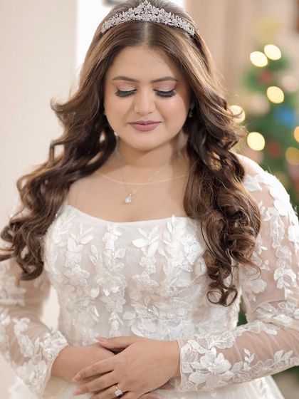 Turning bridal dreams into reality. These portraits showcase the elegance of a Christian bridal look, with a focus on soft, ethereal makeup and a timeless hairstyle.