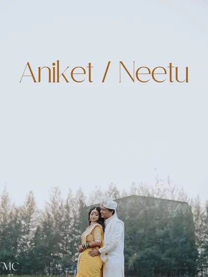 A minimalist and modern take on a couple portrait, with their names elegantly displayed. The focus is on their embrace against a simple, open sky, highlighting their connection.