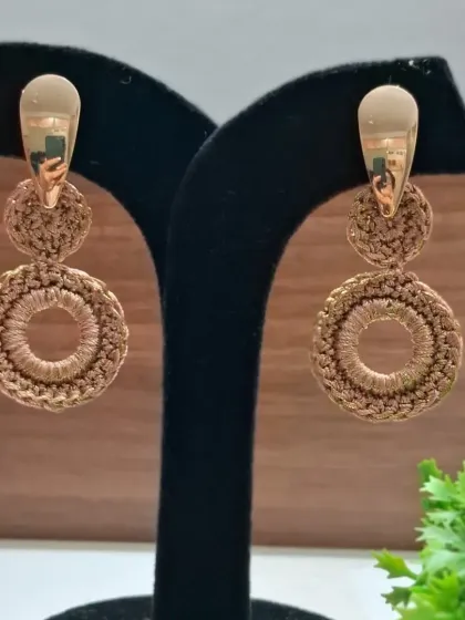 These two-tiered drop earrings in a lovely brown shade are a perfect example of our elegant, lightweight designs. They offer a bit of movement and a lot of style.