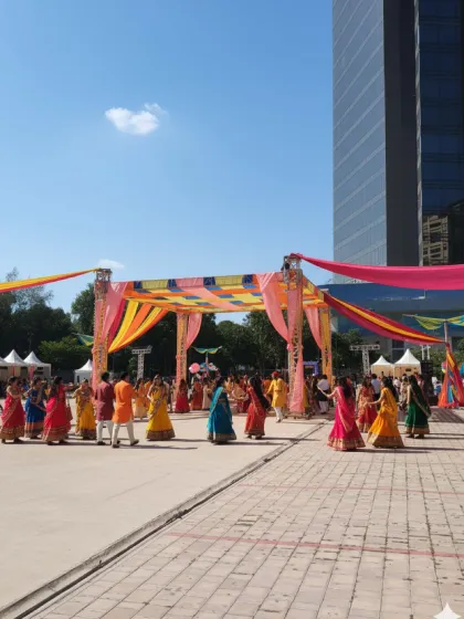Dancers enjoying the event under a large, custom-built canopy. This structure not only adds a decorative element but also provides a defined space for the main festivities.