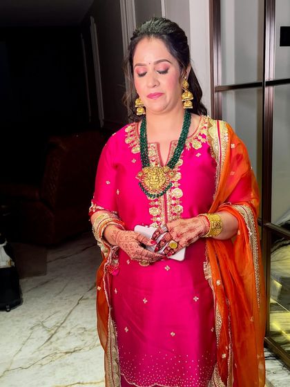 A candid moment, capturing her elegance and the beauty of the overall look.