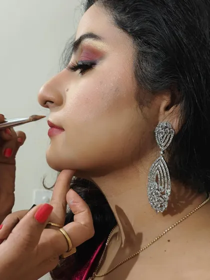 A close-up shot showing the precision and care I take with every detail. Here, I'm defining the lips to create the perfect shape, a crucial step in achieving a polished and complete bridal makeup look.