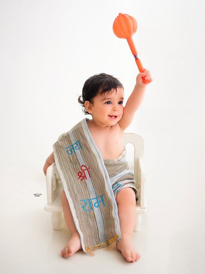 A simple and powerful portrait for Ram Navami, with this little one holding a mace and wearing a sash with 'Jai Shri Ram'.
