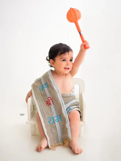 A simple and powerful portrait for Ram Navami, with this little one holding a mace and wearing a sash with 'Jai Shri Ram'.
