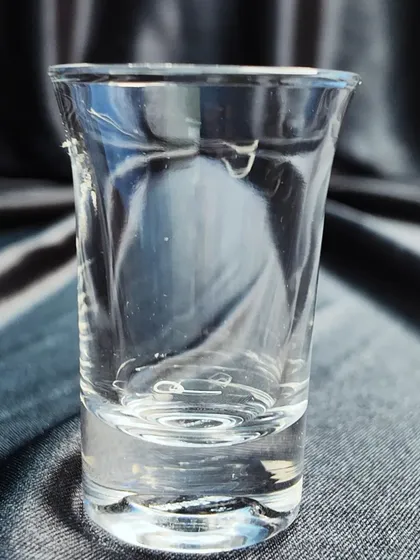A standard shot glass. I have plenty of these available for rent to serve party shots or tasting portions.