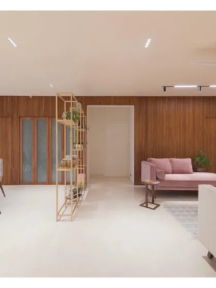 This open-plan living and dining area from the Fluted House project embodies my love for clean lines and textured surfaces. The fluted teakwood wall serves as a warm, natural backdrop, while the layout creates a simple, uncluttered floor plate for a complex and inviting space.