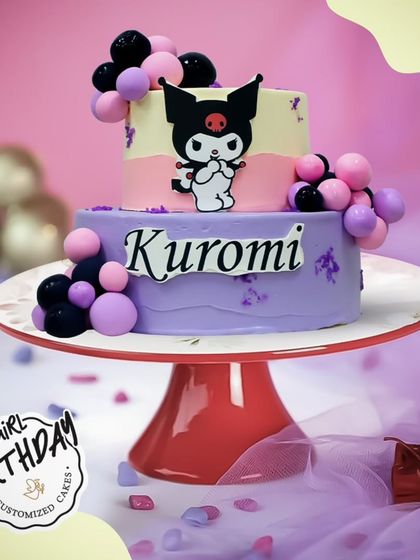 A sassy and fun Kuromi cake. This two-tier design in purple and pink captures the edgy but cute personality of the popular Sanrio character.