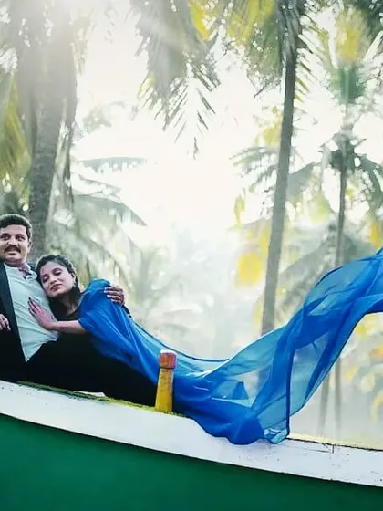 My signature flying saree brings a dramatic, modern twist to a traditional look. The vibrant blue fabric catching the wind on the water creates such a breathtaking shot, perfect for couples who want something unique and beautiful.