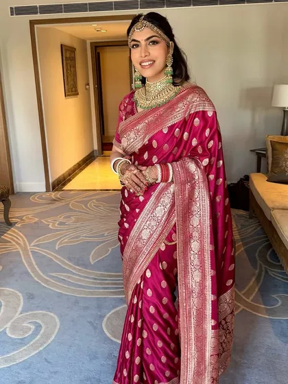 A full view of Varda's post-wedding look. Her radiant makeup perfectly complements the rich tones of her Sabyasachi saree, creating a timeless and elegant statement.