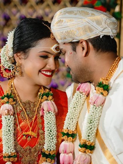 An intimate close up of a couple during their wedding ceremony, capturing their happy smiles and the connection between them.