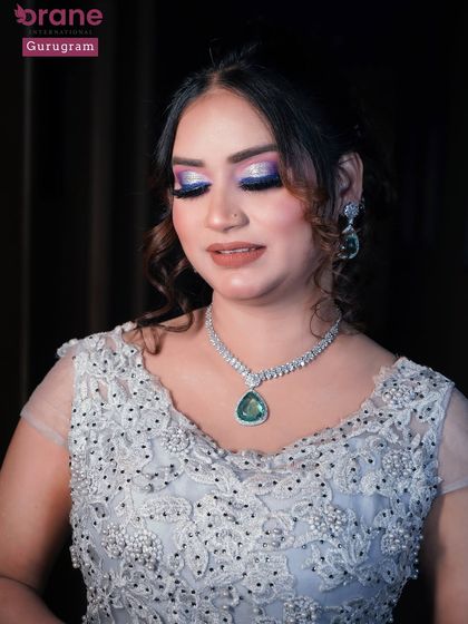 Another beautiful close up of the purple eye makeup, showing the fine glitter and sharp liner work. Precision is a key skill I emphasize in all my classes.