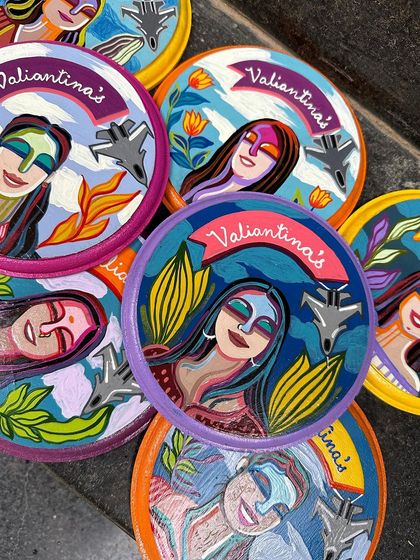 More details of the 'Valiantinas' squadron plates, showcasing the variety of portraits and colorful backgrounds.
