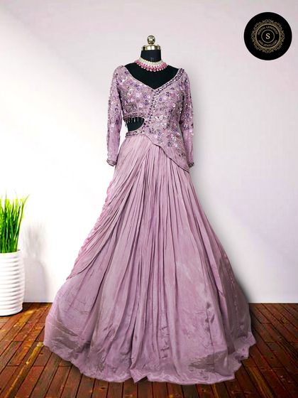 Rent our beautiful gowns and slay like a pro at your event. This elegant lavender gown with a side cutout is a modern and chic choice for a reception or cocktail party.