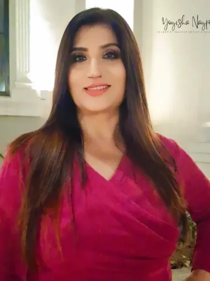 Another shot of this simple yet elegant evening look. The makeup is subtle enough to let her natural beauty shine through, perfect for any sophisticated gathering.