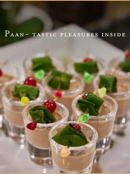 A classic reimagined with grace. Our signature paan mousse shots offer the refreshing flavours of a traditional paan in a smooth, creamy dessert form, garnished with a cherry and betel leaf.