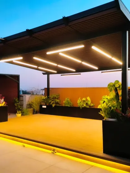 Another shot of the Palam Vihar pergola, showing the warm glow of the under-deck and ceiling lights.