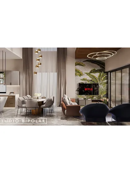 A view across the open-plan space, showing the dining area and the statement tropical wallpaper on the TV wall. The design creates a cohesive yet dynamic environment for family life.