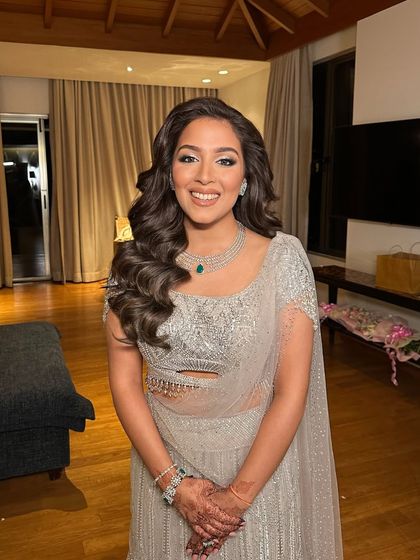 Another shot capturing the joy and elegance of this classic curly hairstyle.