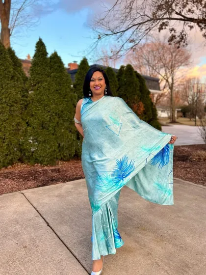 This client looks like a breath of fresh air in this light blue printed saree. The drape is perfect, and she wears it with so much grace.