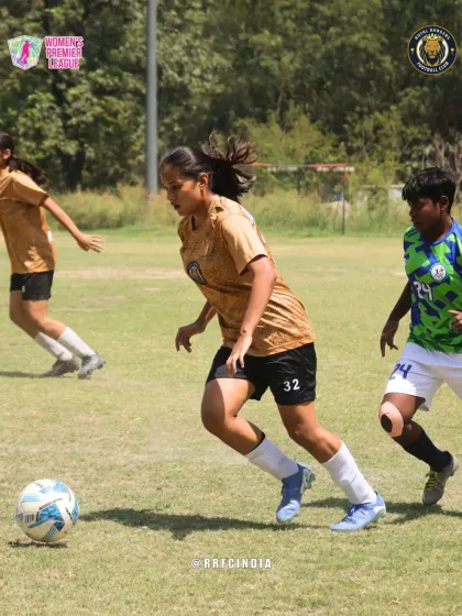 Our player on the attack, dribbling at speed and looking to create a scoring opportunity while being pursued by defenders.