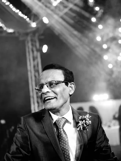The happy father of the bride enjoying the reception. Capturing the joy of the family is just as important as capturing the couple's.