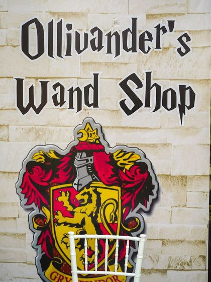 A custom-designed "Ollivander's Wand Shop" stall, one of the many creative activity stations that bring the world of Harry Potter to life.