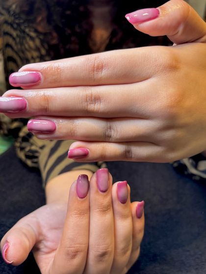 A full view of the pink aura nails, showing the subtle gradient on each finger for a cohesive and dreamy look.
