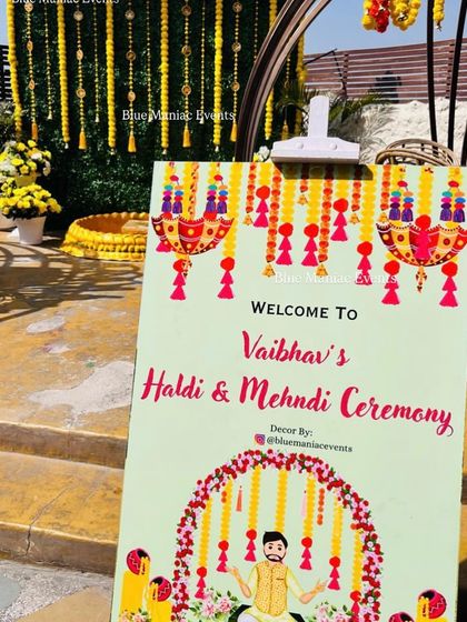 A personalized welcome sign for the groom's Haldi and Mehendi ceremony. I can create custom stationery and signs to match your event's theme and decor.