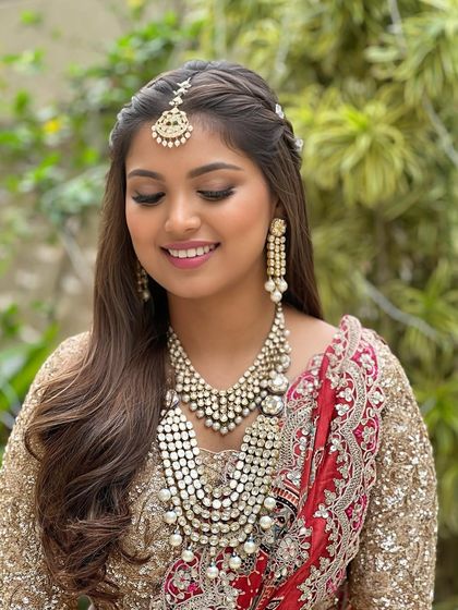 A close-up showing the soft, shimmery eye makeup and the flawless, glowing base. It's a look that is both classic and modern.