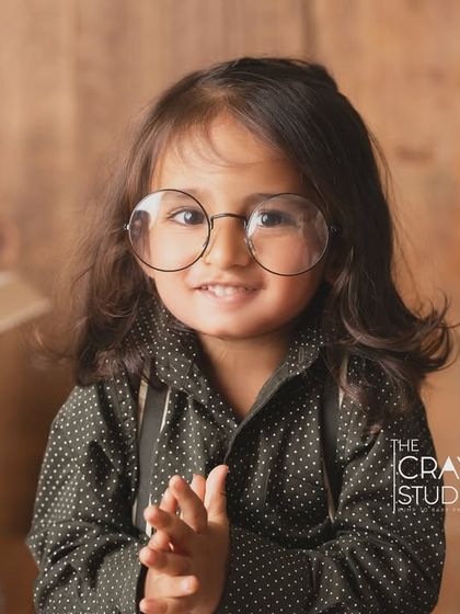 The cutest little professor. Wearing oversized glasses, this toddler looks ready to share his wisdom.