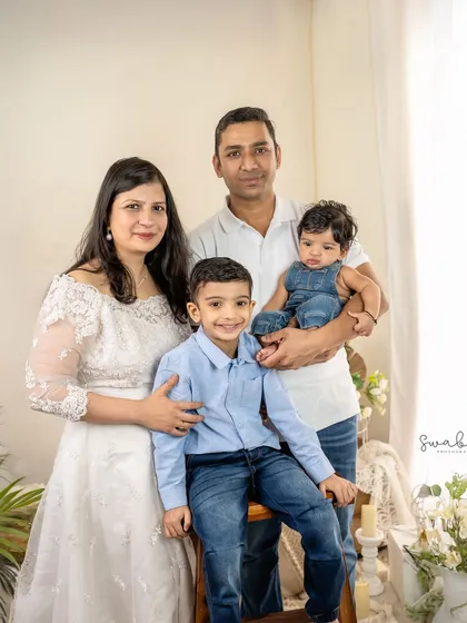 A classic and beautiful portrait of a family of four. I work to make everyone feel comfortable, resulting in natural smiles and a photo you'll treasure.