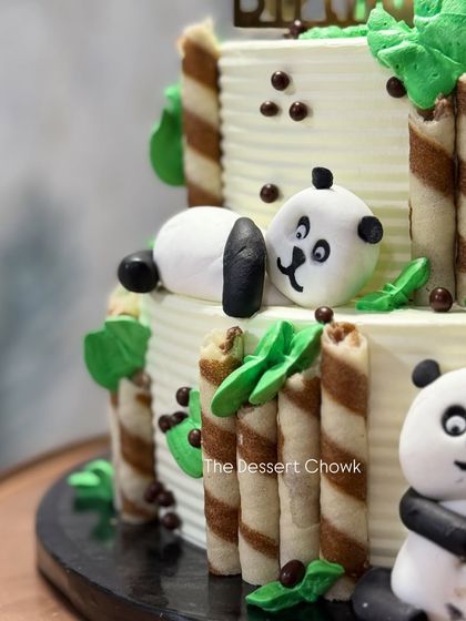 A close-up look at the sleepy fondant panda on the two-tier panda cake. I love adding these small, playful details to my creations.